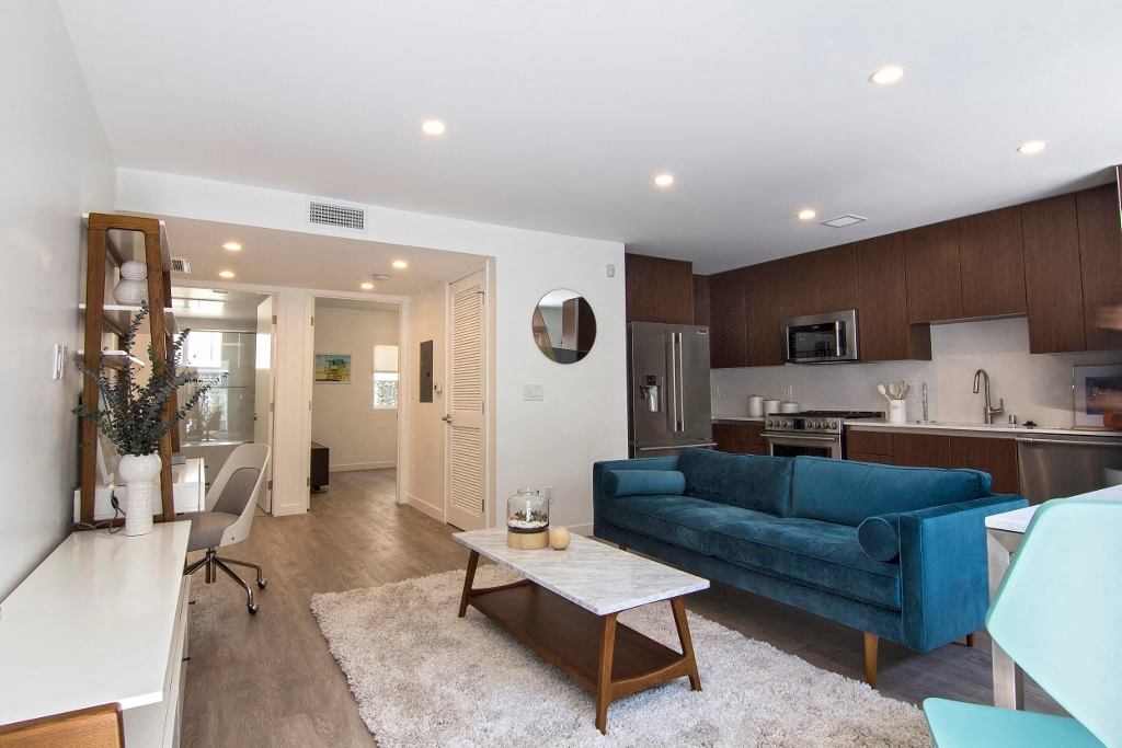 a living room with a couch and a table